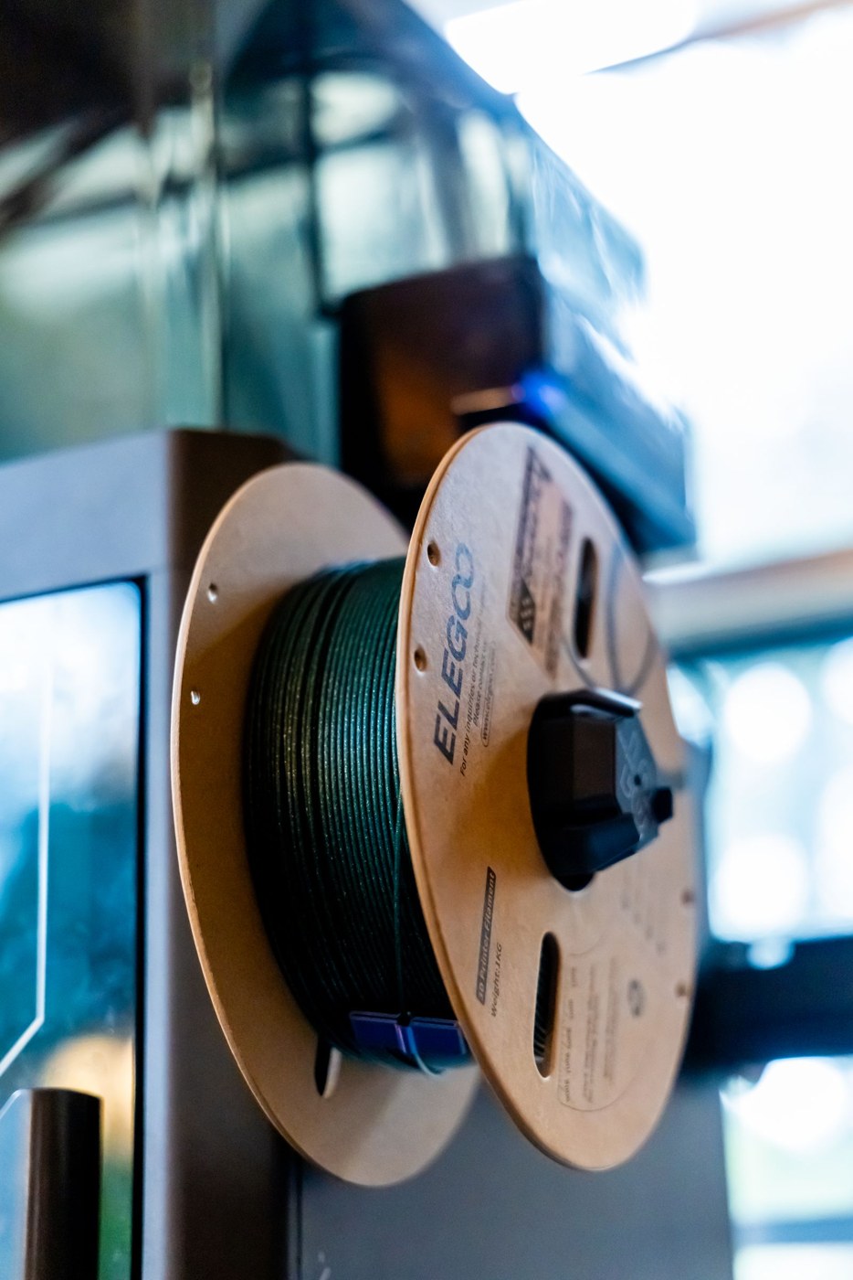 Filament spool with a printed material label