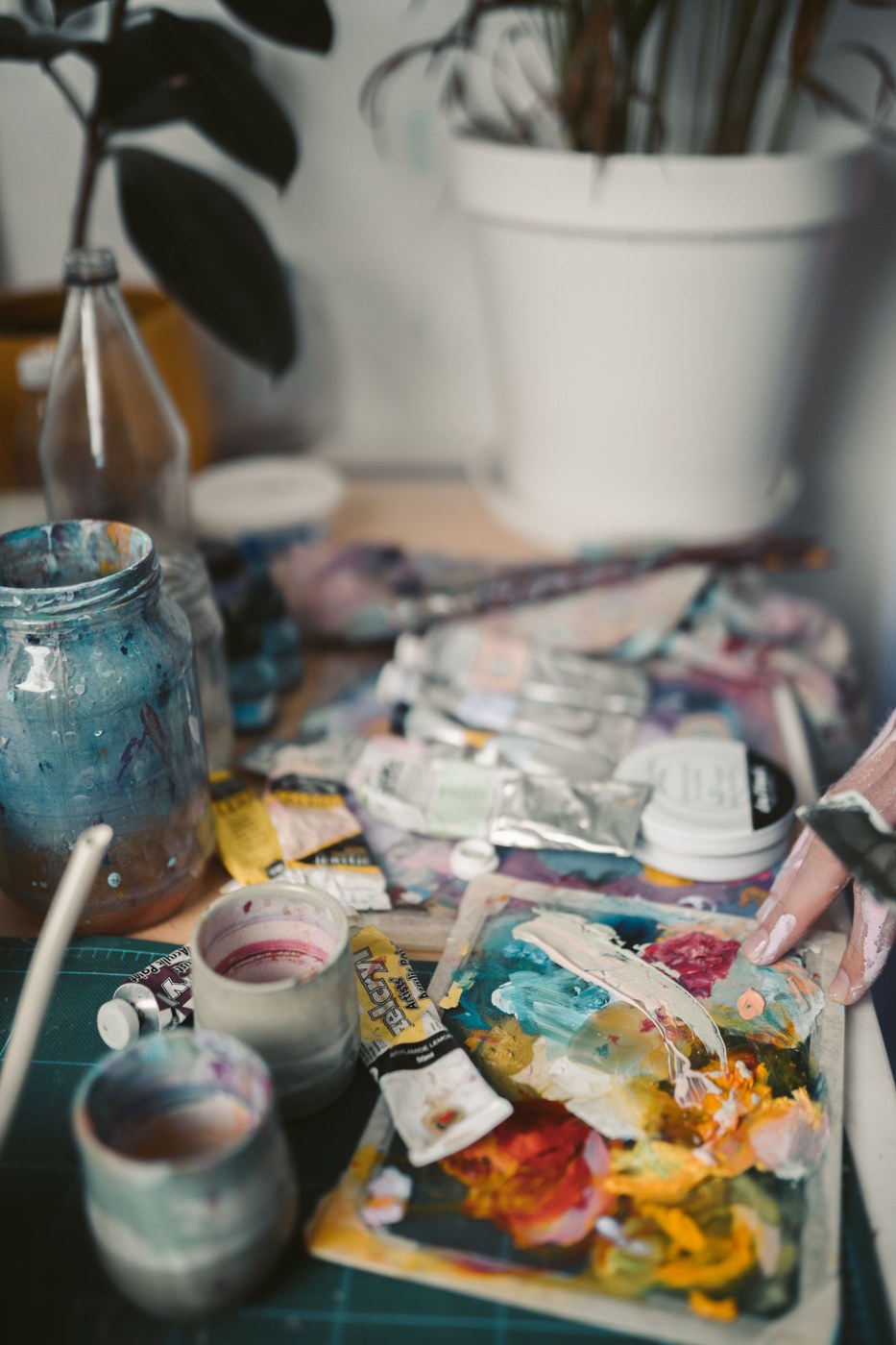 Paint palette and mixing supplies on a tabletop