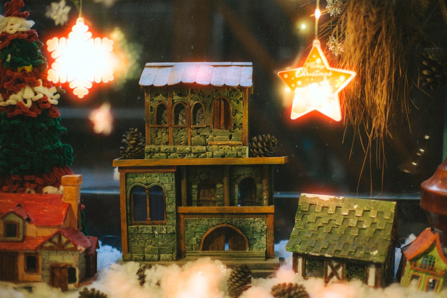 Miniature buildings in an artificial snow display